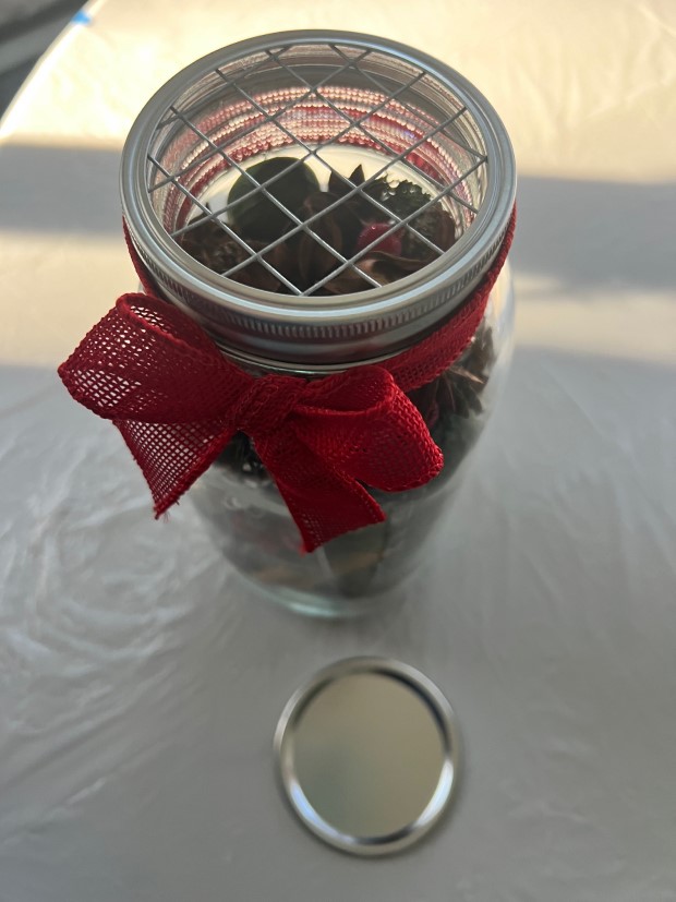 Various completed aroma jars displaying different designs and themes.