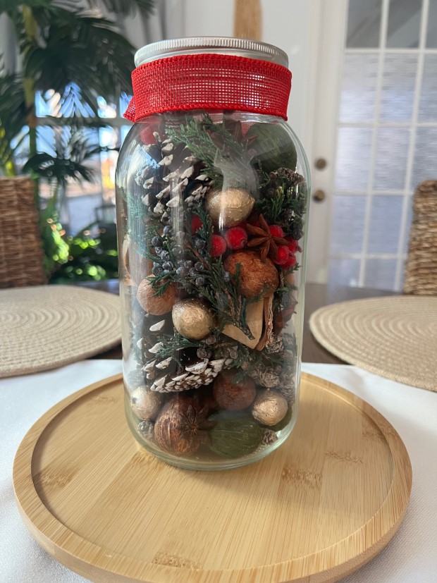 Various completed aroma jars displaying different designs and themes.
